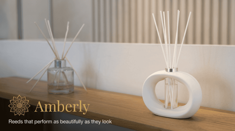 Amberly brand display with a ceramic reed diffuser on a wooden shelf and a gold floral logo.